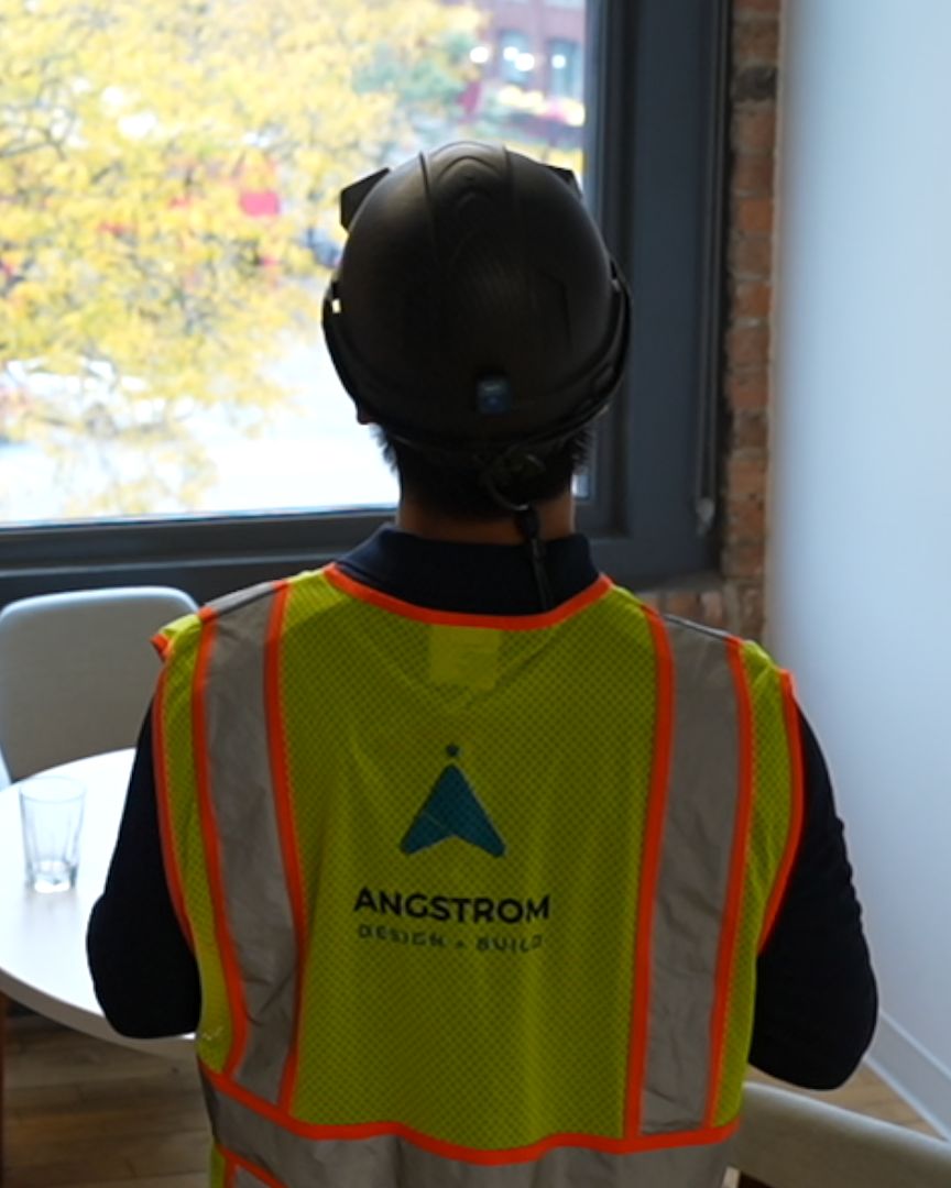 A scan operator wearing the helmet looks over a finished room